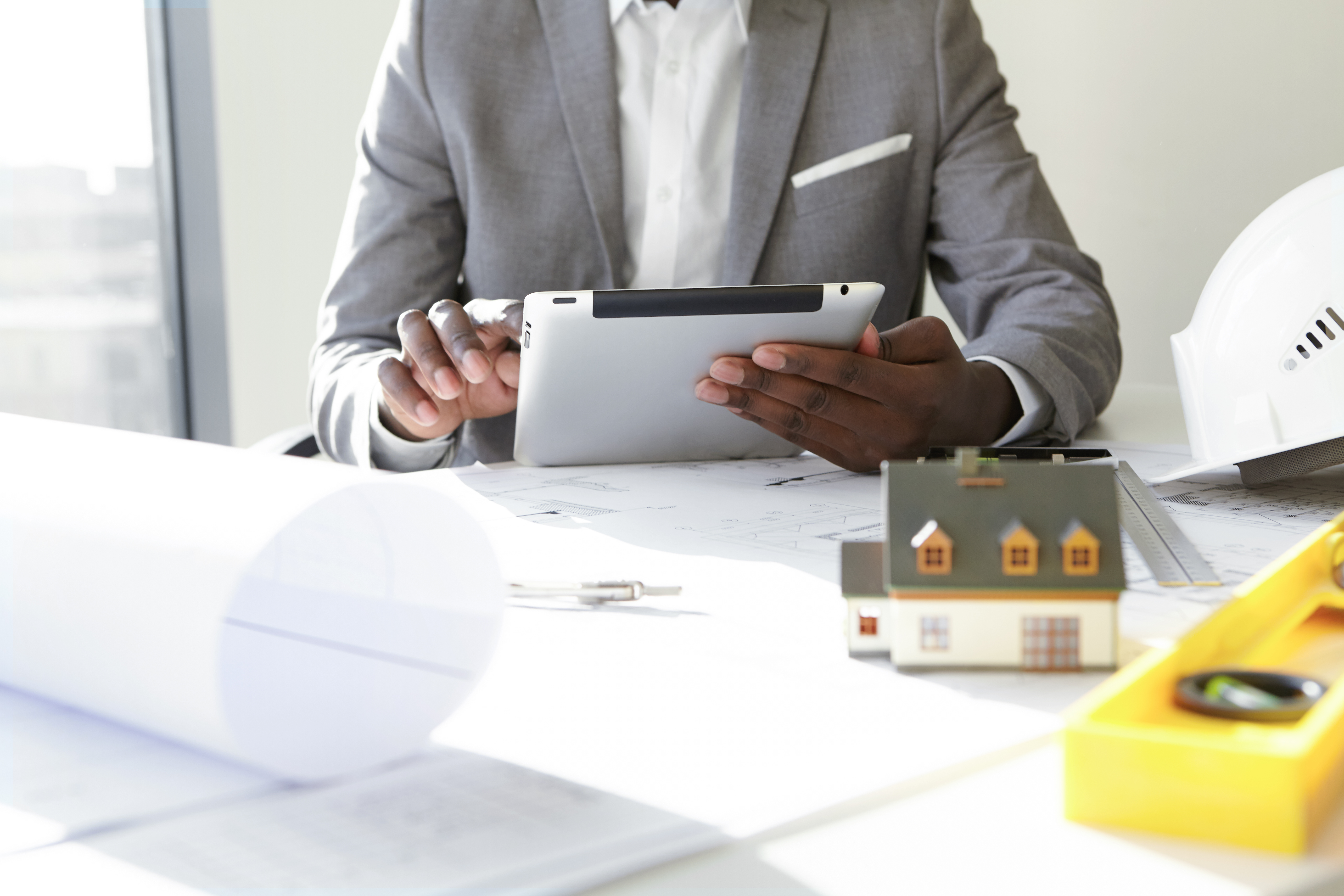 Kenyan couple reviewing mortgage and home-financing documents